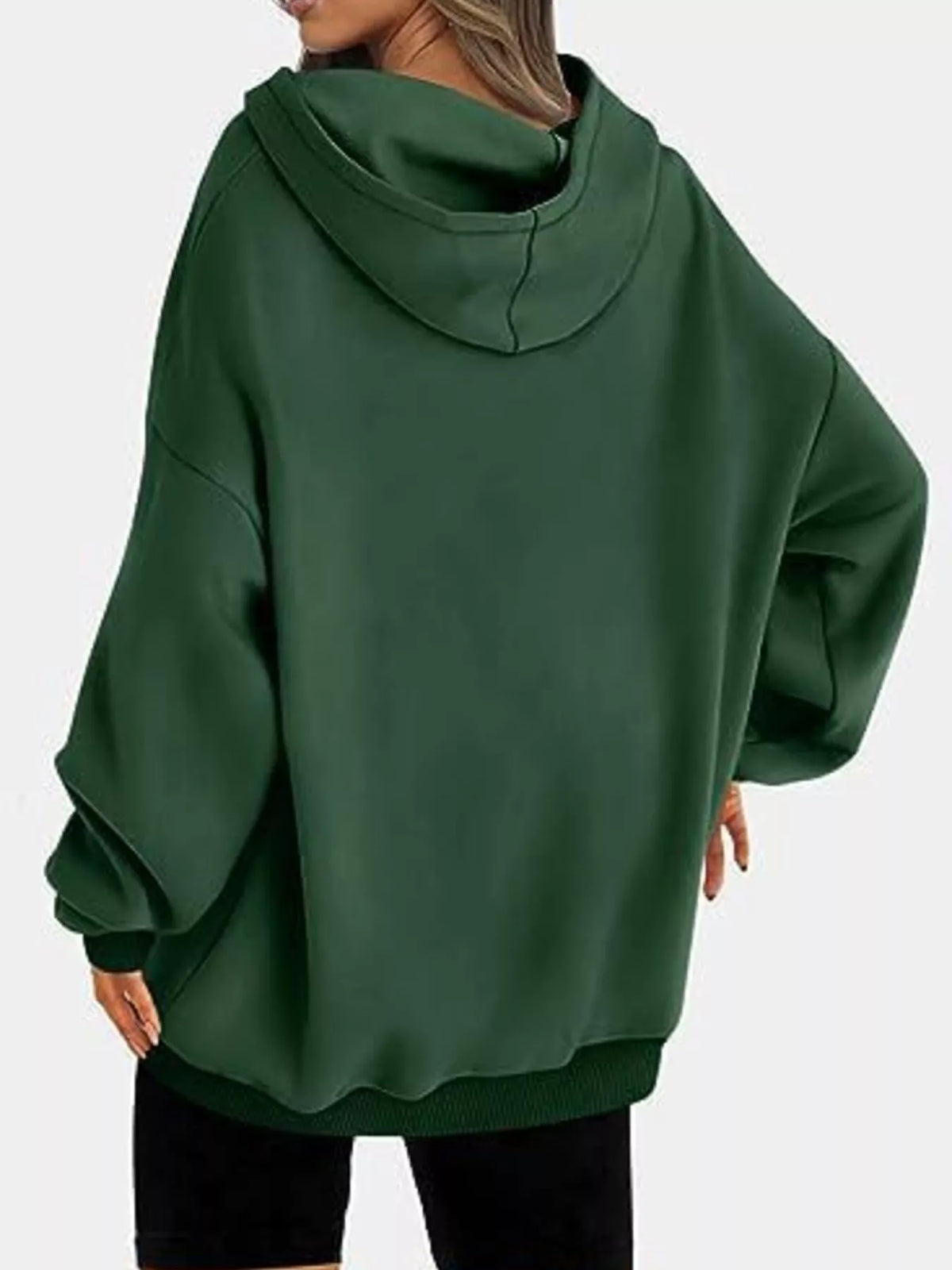 Green oversized hoodie worn by a person on a white background