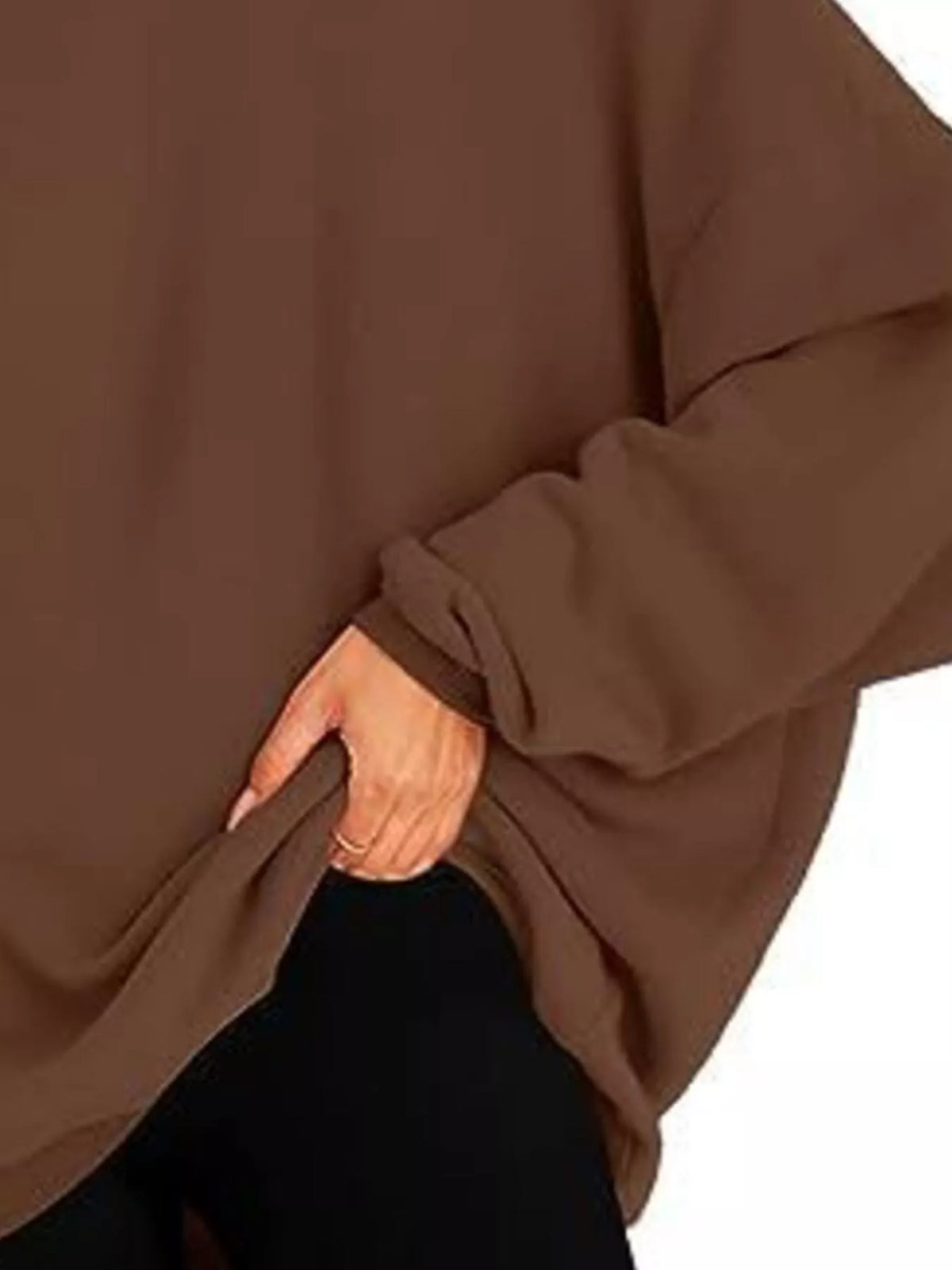 Brown oversized hoodie worn by a person on a white background