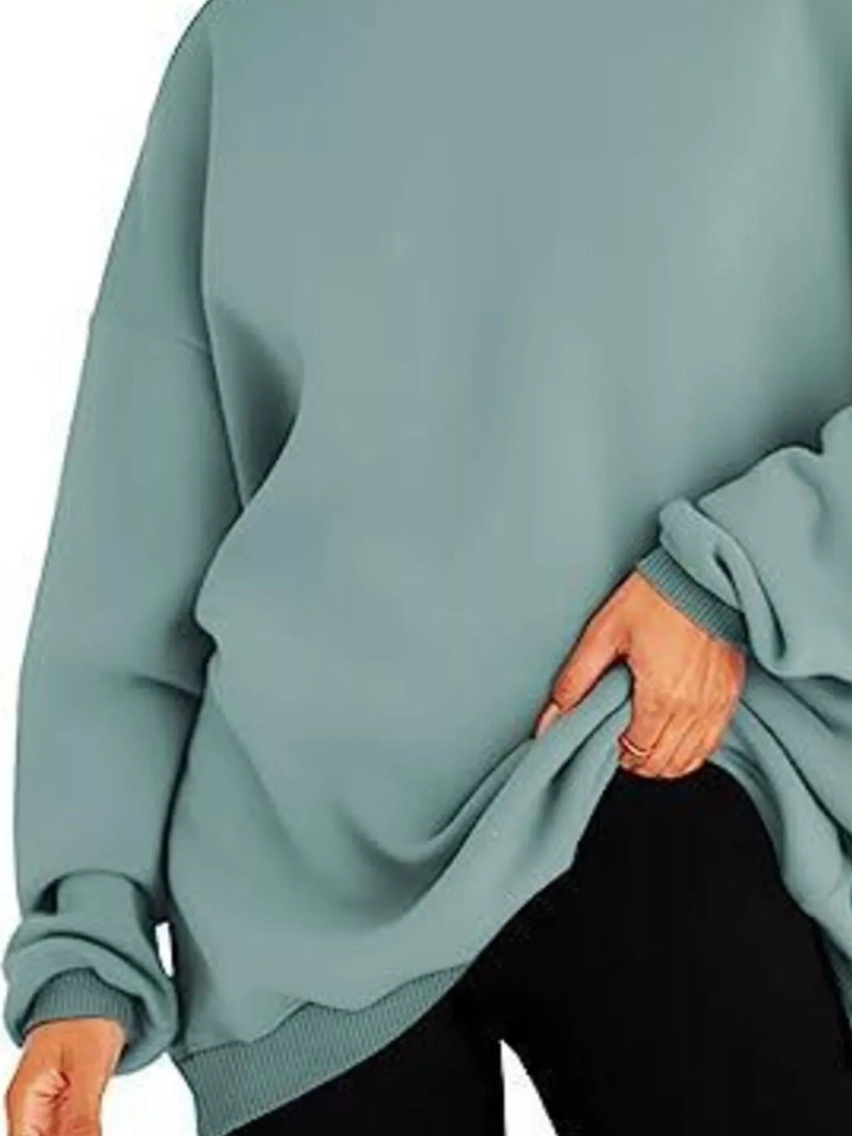 Teal hoodie worn by a person on a white background
