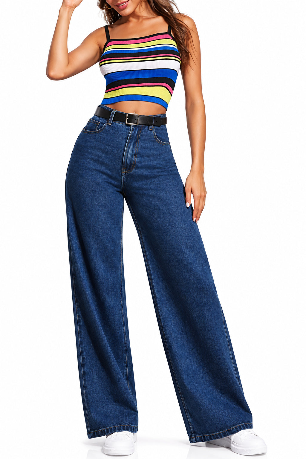 Person wearing a colorful striped tank top and blue wide-leg jeans on a white background