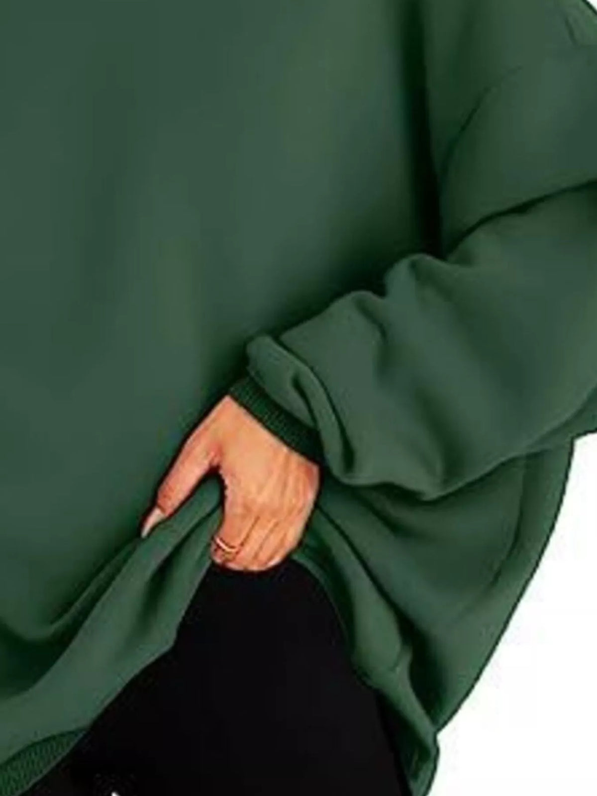 Green oversized hoodie worn by a person on a white background