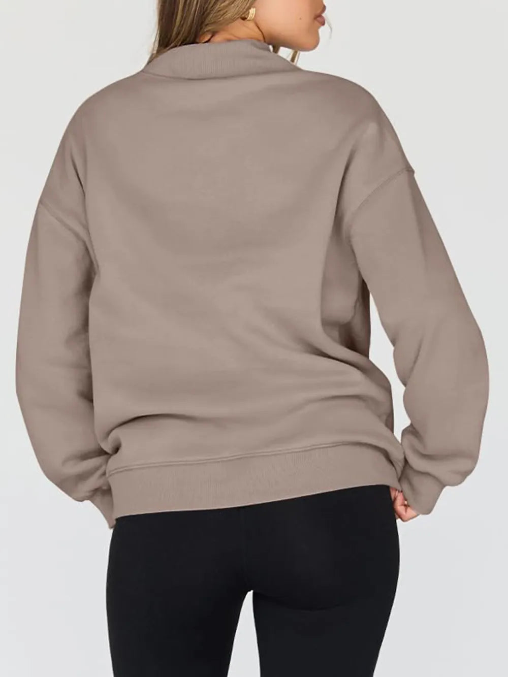 Person wearing a beige jacket on a white background