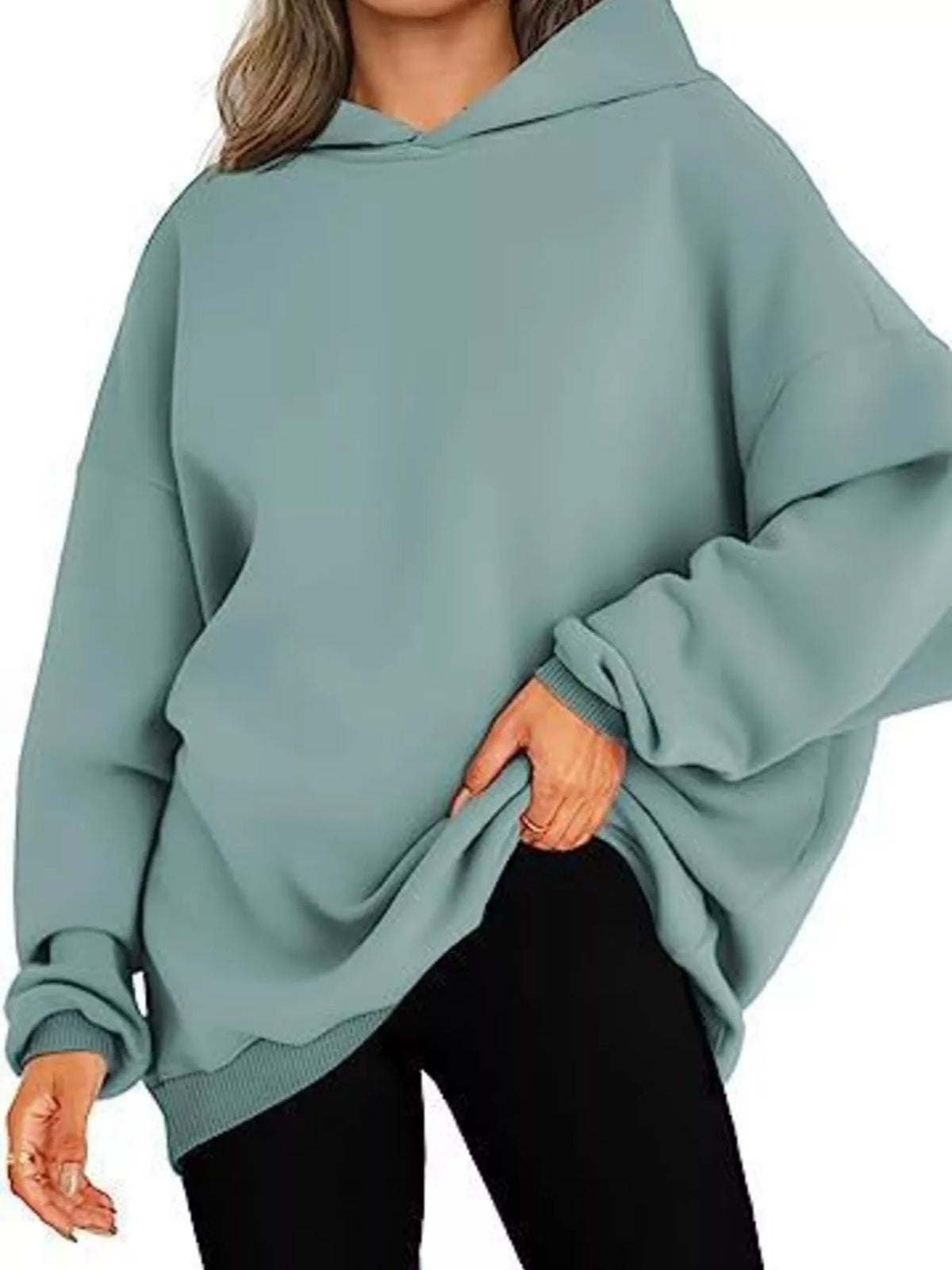 Teal hoodie worn by a person on a white background