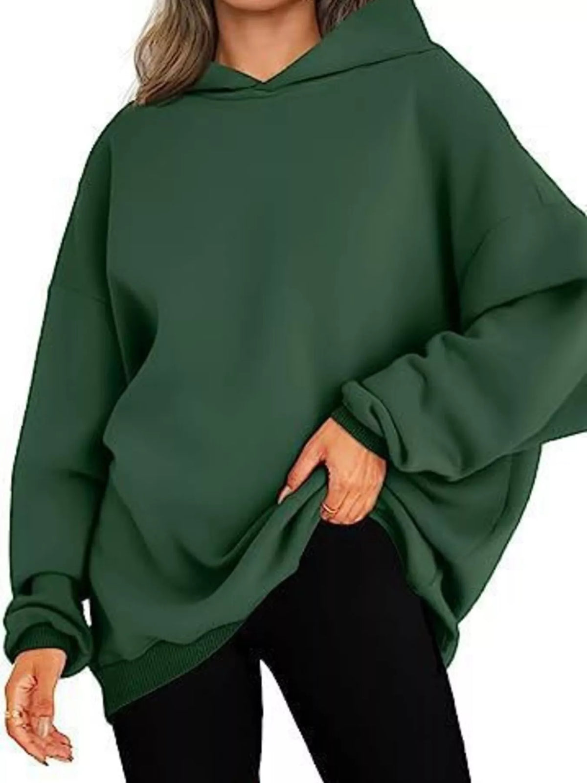 Green oversized hoodie worn by a person on a white background