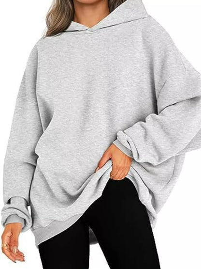 Teal hoodie worn by a person on a white background