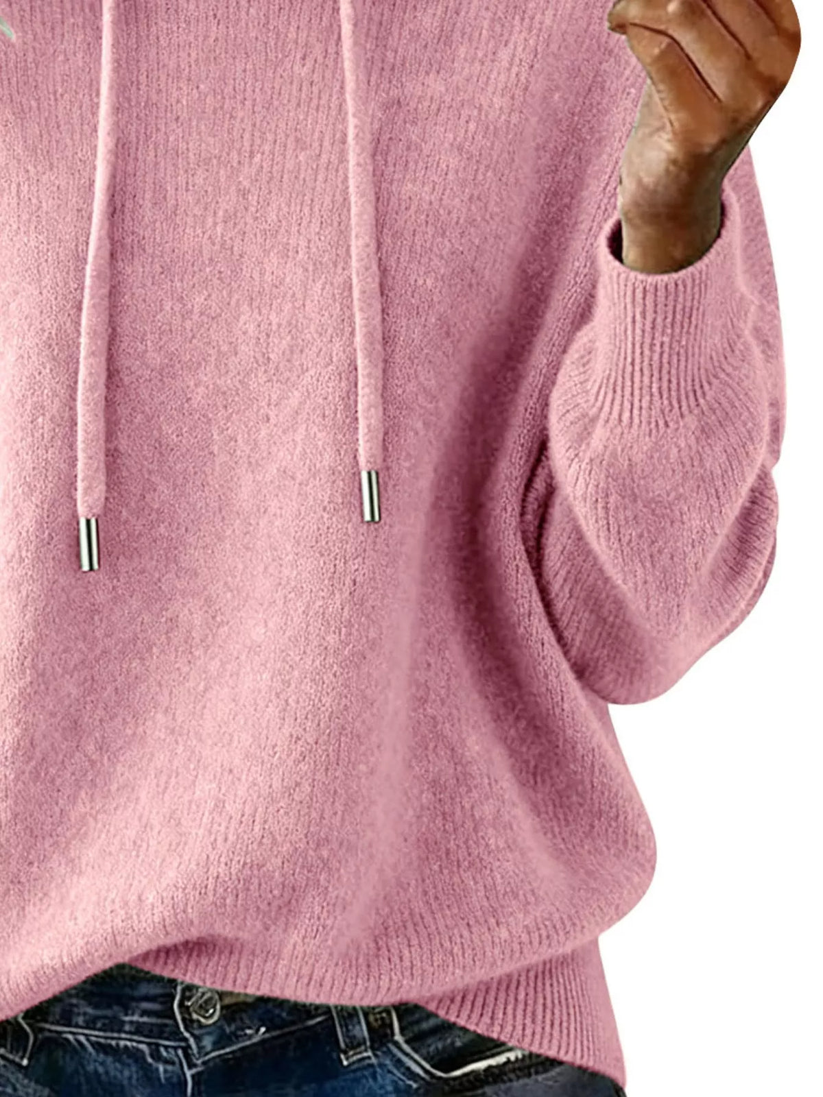 Close-up of a pink hoodie with a blurred background
