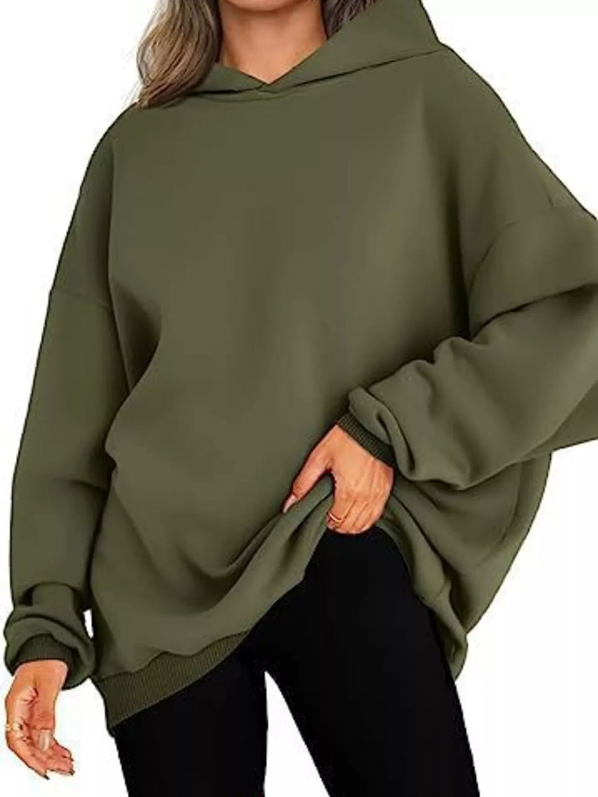Person wearing a green hoodie on a white background