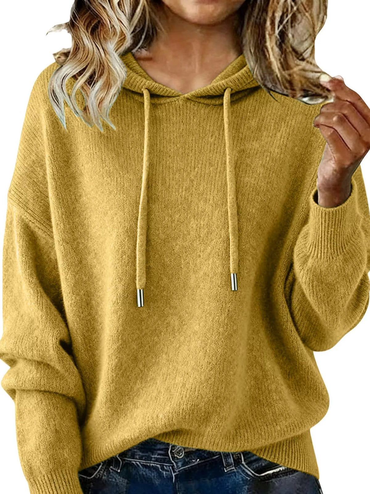 Mustard yellow hoodie worn by a person