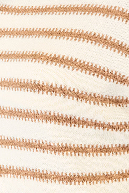 Close-up of a fabric with brown striped pattern on a white background