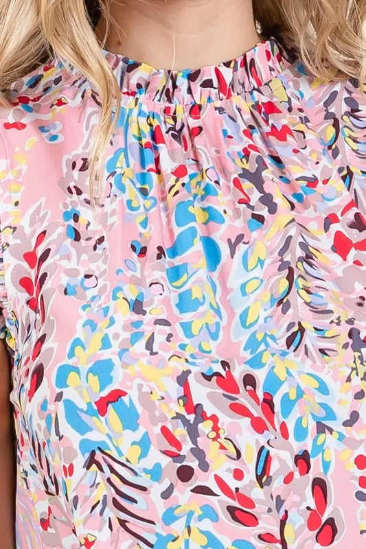Plus‑size graphic print sleeveless top with ruffle trim and mock neck in Pink by Lime ’N’ Chili