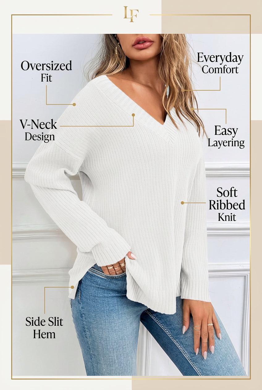 Woman wearing a white oversized ribbed knit V-neck sweater featuring long sleeves, side-slit hem, relaxed fit silhouette, and soft textured fabric for cozy everyday styling. Color & Features and Specs