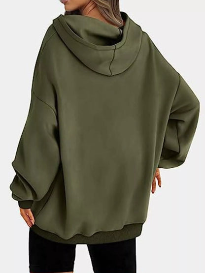 Person wearing a green hoodie on a white background