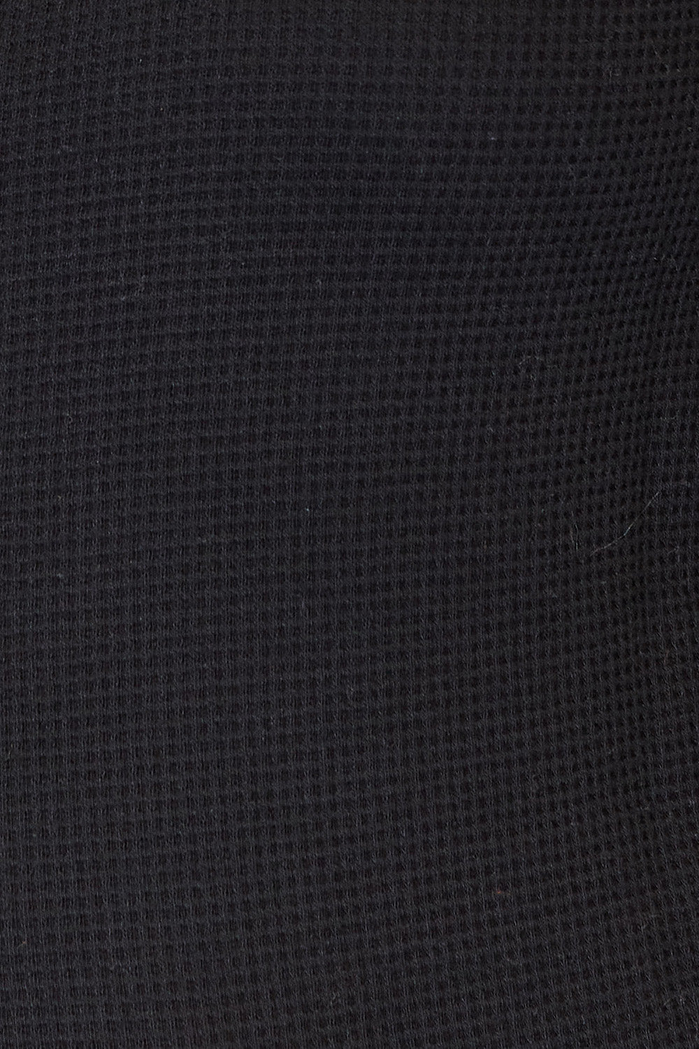 Close-up of a textured black fabric surface