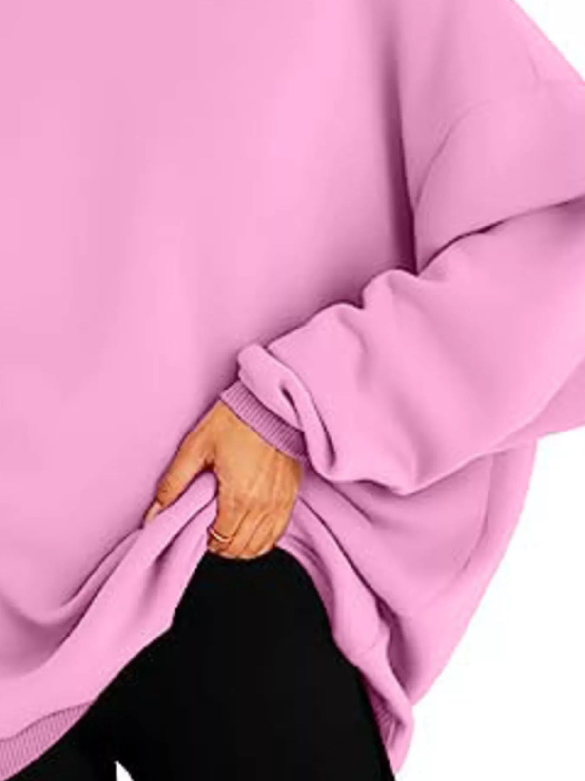 Pink hoodie worn by a person on a white background